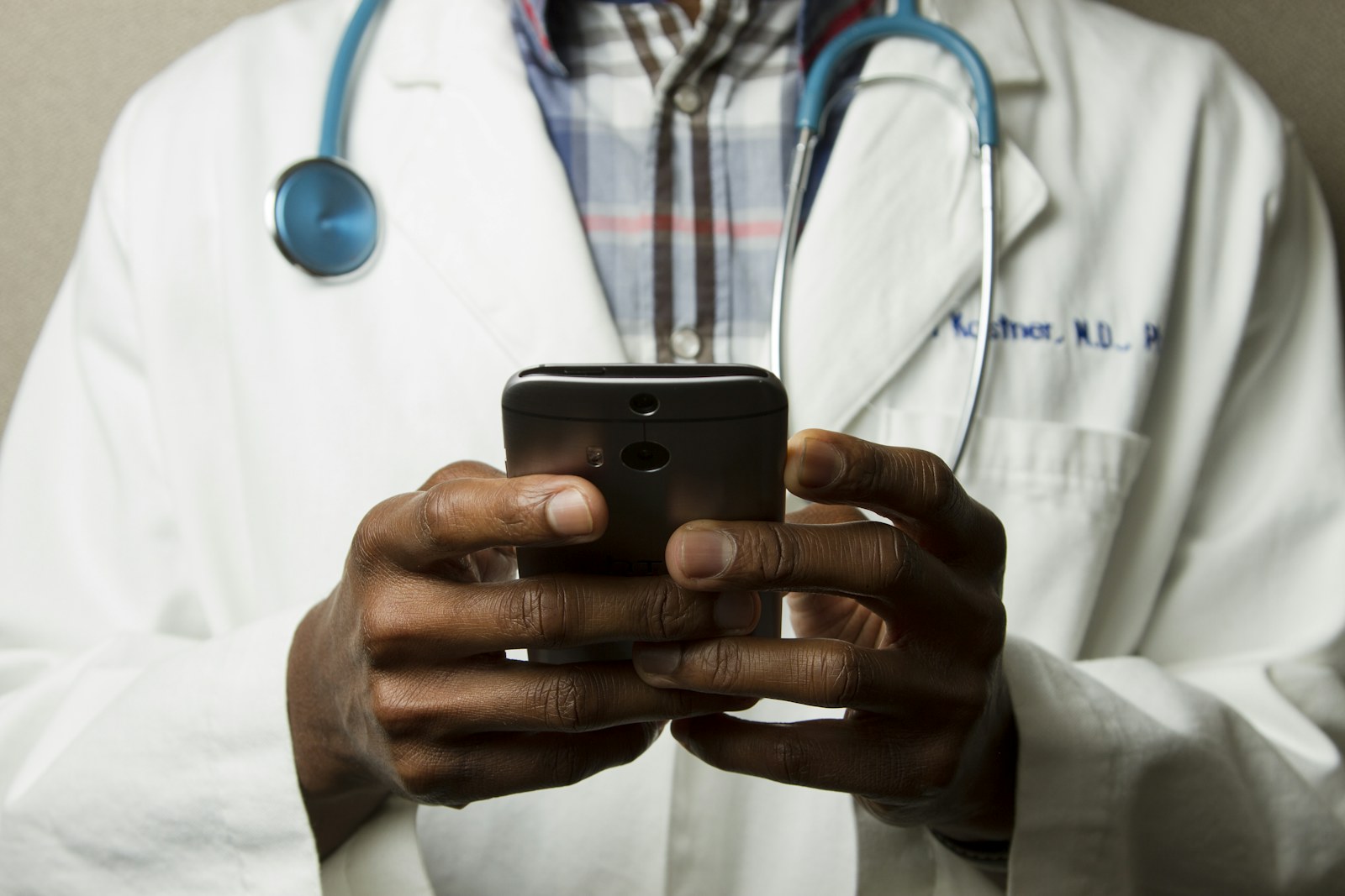 Healthcare professional reviewing information on a mobile device